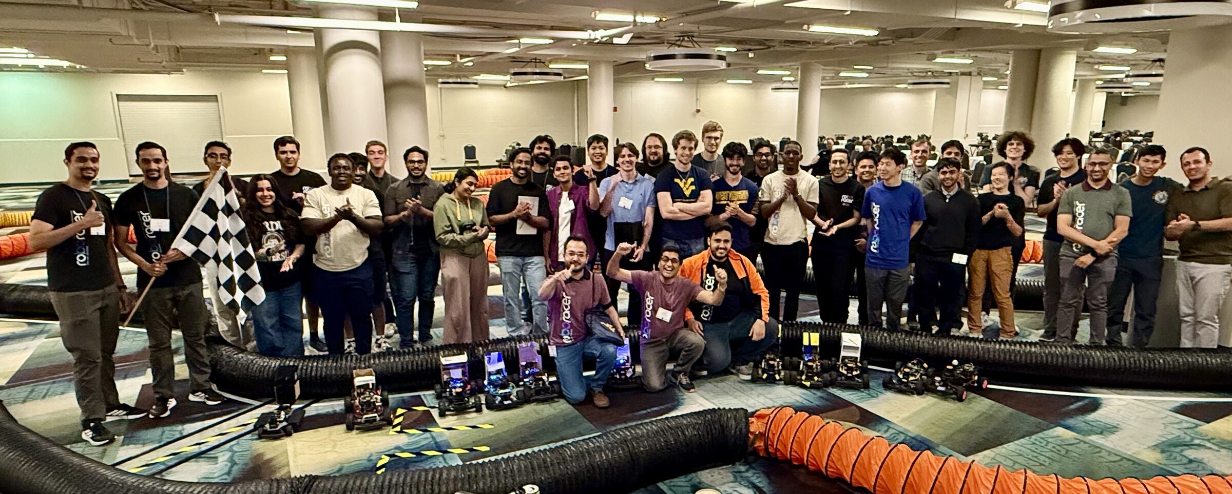 All competing teams gathered around the track at Roboracer IV 2026