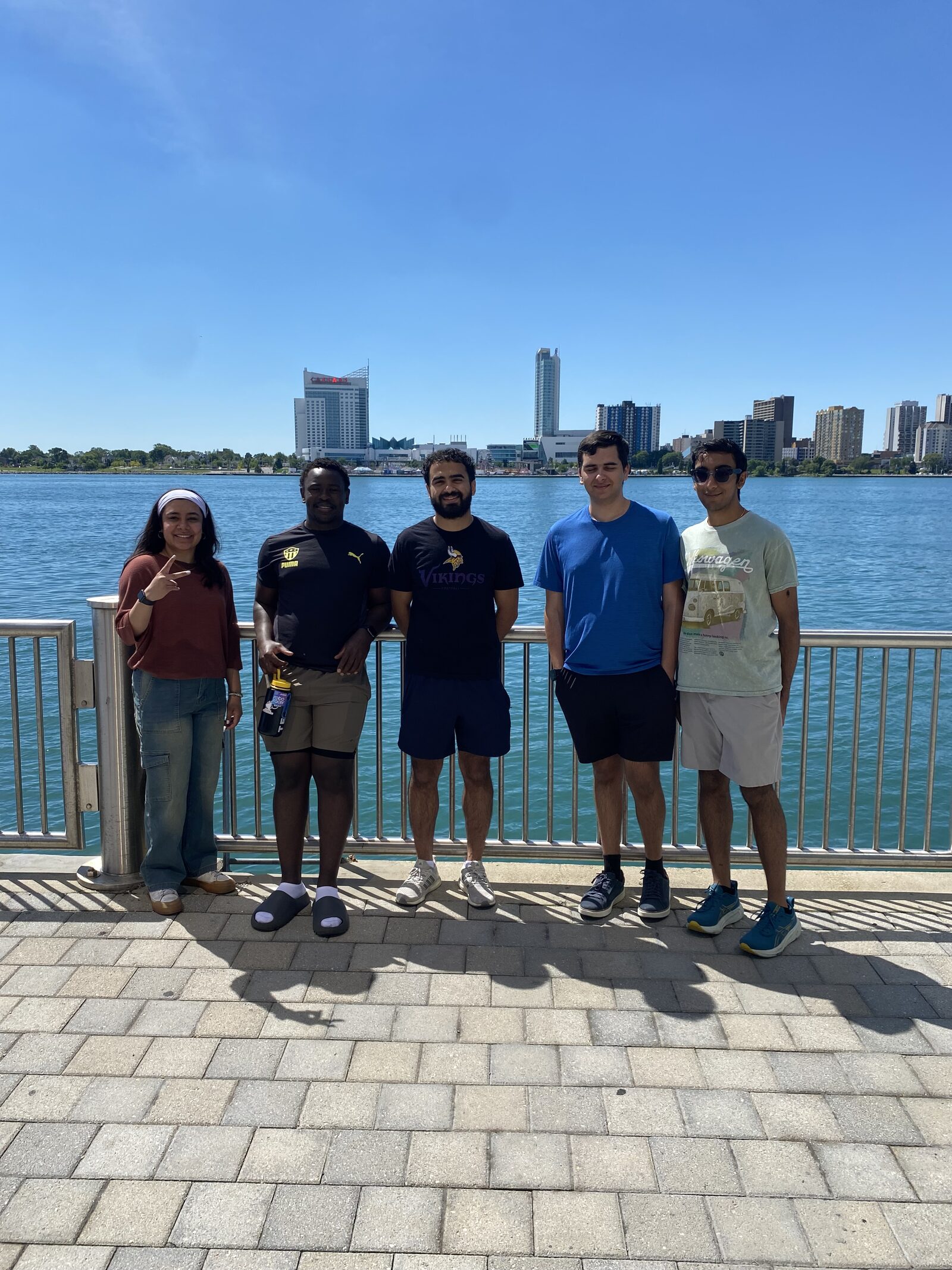 Team members on the Detroit riverfront during race weekend